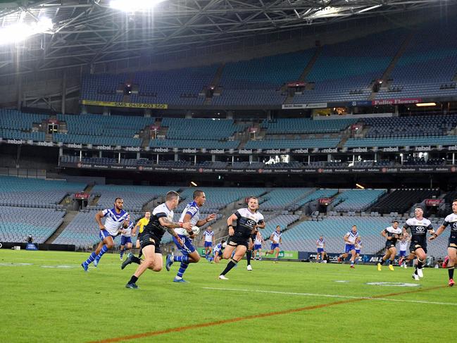 Will Hopoate of the Bulldogs makes a break during the round two NRL match between the Canterbury-Bankstown Bulldogs and North Queensland Cowboys at ANZ Stadium, in Sydney, Thursday, March 19, 2020. (AAP Image/Dan Himbrechts) NO ARCHIVING, EDITORIAL USE ONLY