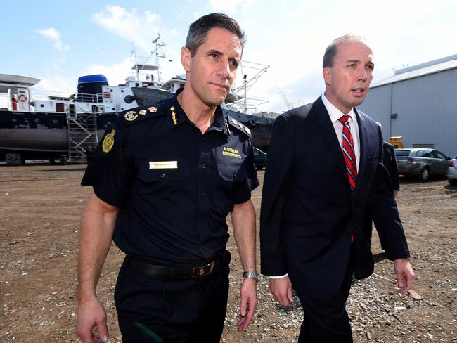 Immigration Minister Peter Dutton and Australian Border Force commissioner Roman Quaedvlieg arrive to inspect the yacht Solay in Brisbane, Thursday, Sept. 3, 2015. Seventy kilograms of cocaine was seized by authorities when the boat berthed at Coomera on the Gold Coast last week. (AAP Image/Dan Peled) NO ARCHIVING