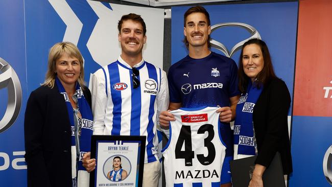 Brynn Teakle poses with his family after receiving his No.43 Roos jumper. Picture: Michael Willson/AFL Photos via Getty Images