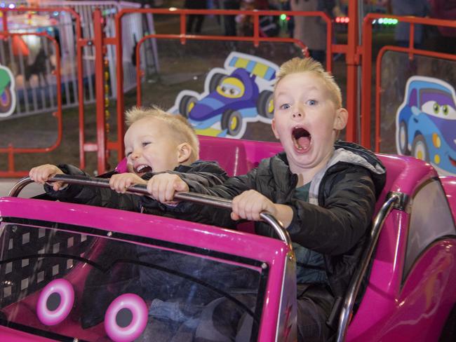 Brothers Angus, 3 and Ewan, 6. crowds having fun on the Royal Melbourne Show rides. Picture: Jason Edwards
