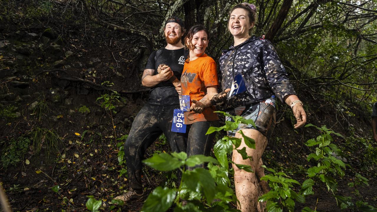 Negotiating the wet and muddy conditions are (from left) Anthony Birkett, Danni Gilbert and Kymmy Birkett during Run the Range Milne Bay Challenge 2022 in Jubilee and Redwood Parks, Sunday, May 22, 2022. Picture: Kevin Farmer