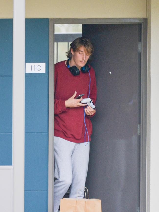 Joshua Worrell collects a bag during Adelaide’s isolation in the Barossa Valley.