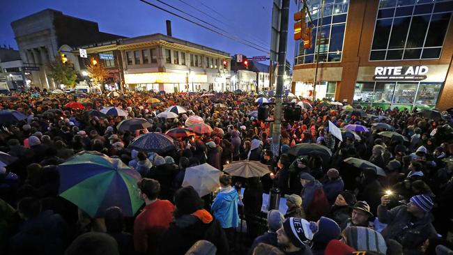 A crowd gathers in the Squirrel Hill section of Pittsburgh for a memorial vigil for the victims of the shooting at the Tree of Life Synagogue. Picture: AP / Gene J. Puskar