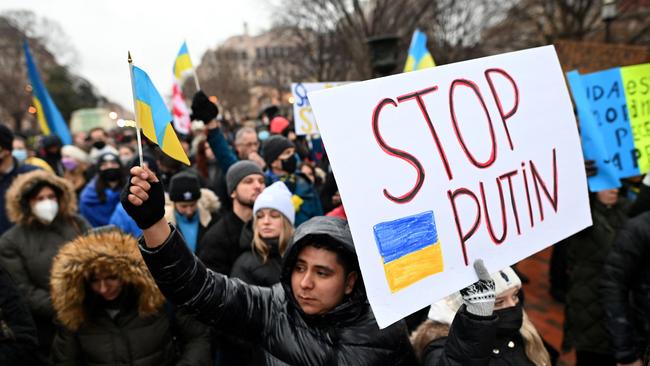 Activists hold placards and flags as they gather in Lafayette Square to protest Russia's invasion of Ukraine in Washington, DC, on February 24. PIcture: AFP