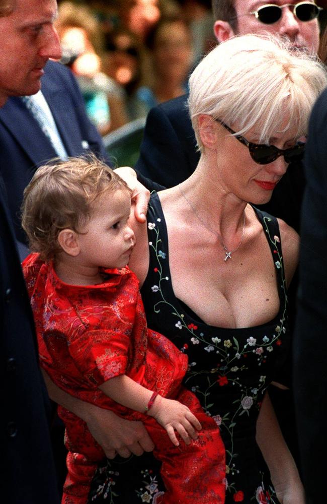 Tragic loss ... Tiger Lily with her mother Paula Yates at the funeral of  Michael Hutchence.