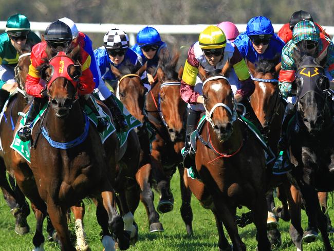 Loving home ridden by Tye Angland  (yellow cap, maroon with yellow armbands) wins race 1 during Scone  Races located in the Upper Hunter Region of NSW. The Bend . Pic Jenny Evans