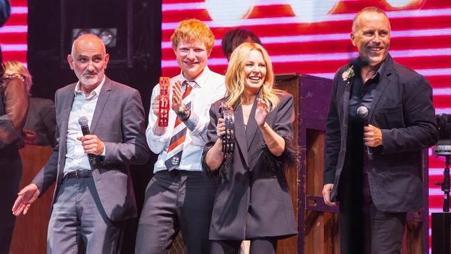 Mark Seymour (right) performs with Paul Kelly, Ed Sheeran and Kylie Minogue at Rod Laver Arena on March 24, 2021. Picture: Mushroom Creative House