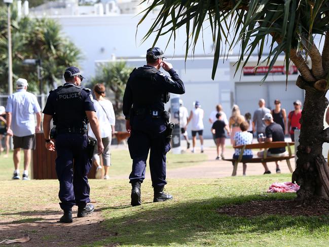 Plenty of people are enjoying the day and beaches at Burleigh for Mothers Day where Police are in the park talking to poeple. Pics Adam Head