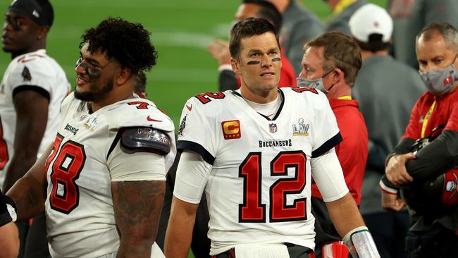 Tom Brady #12 of the Tampa Bay Buccaneers looks on as the celebrations break out. Picture: Mike Ehrmann/Getty Images