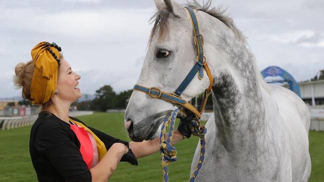 Anna Lukyanova having a chat with Smokey the Clerk of the Course horse about the Prime Ministers Cup Day at the Gold Coast Turf Club. Picture Glenn Hampson