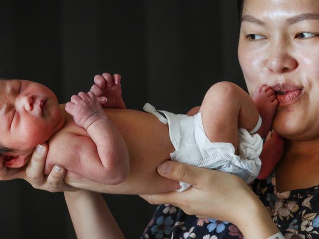 Newborns having heel prick test for story about new heel pick blood test being offered to Victorian newborn. Mum Quyen Khajavee kisses new born daughter Sahar Khajavee after a heel prick test at the Joan Kirner Womens and Childrens Hospital.                                                              Picture: David Caird