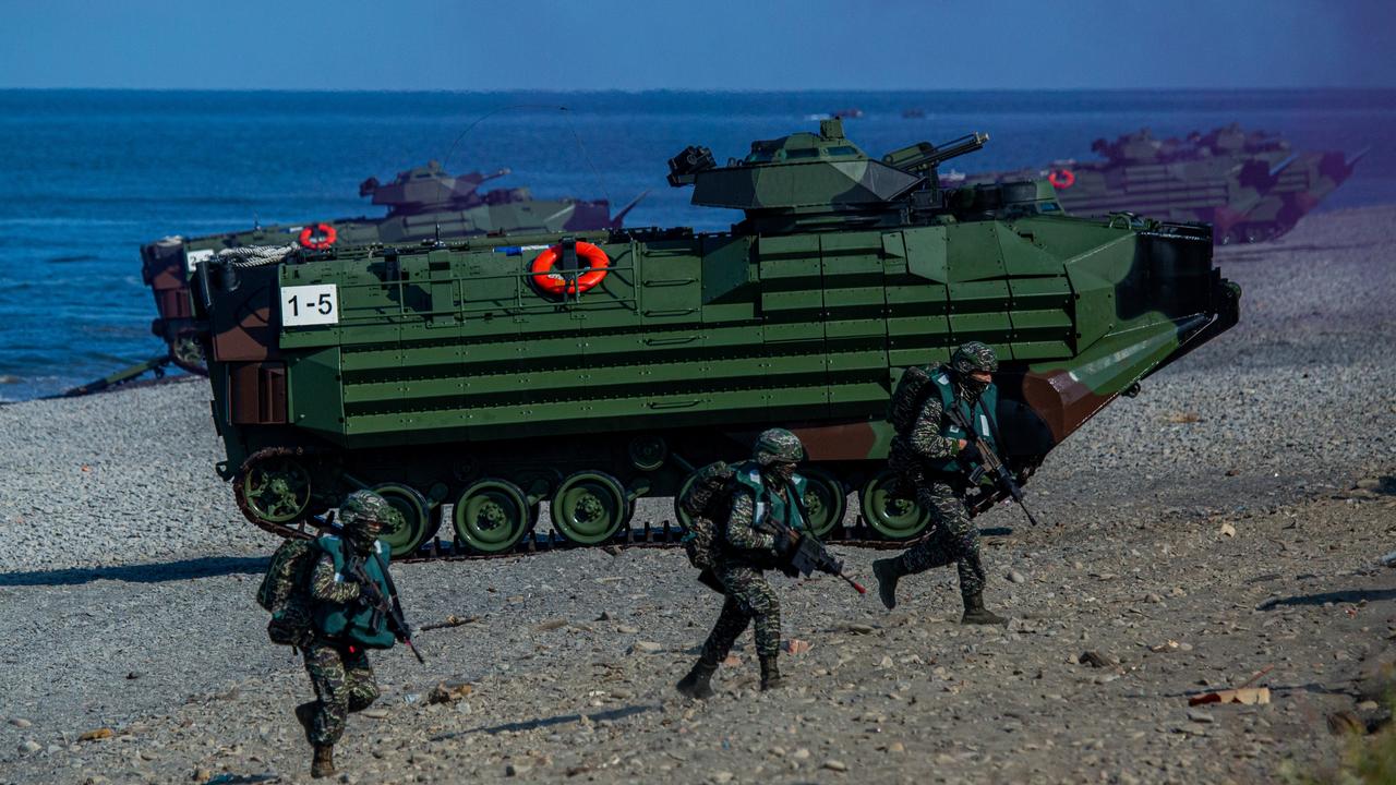 Soldiers disembark from AAV7 amphibious assault vehicles during the Han Kuang military exercise, which simulates China's People's Liberation Army (PLA) invading the island, on July 28, 2022 in Pingtung, Taiwan. Picture: Annabelle Chih/Getty Images.