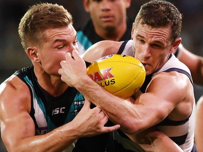 Ollie Wines of Port Adelaide and Joel Selwood of the Cats.