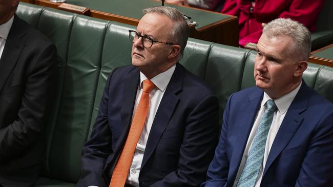 Anthony Albanese and Tony Burke watch Jim Chalmers hand down the 2023 Budget. Picture: Martin Ollman/Getty Images