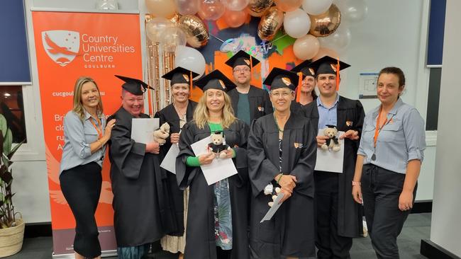 The latest Country Universities Centre Goulburn graduates with Centre Coordinator, Cathy McNiven (left), and Centre Manager Isabella Lesslie (right).