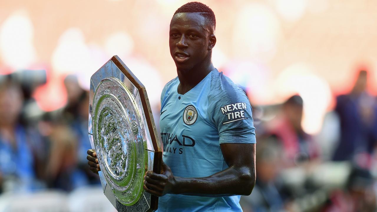 Benjamin Mendy of Manchester City celebrates with the Community Shield trophy.
