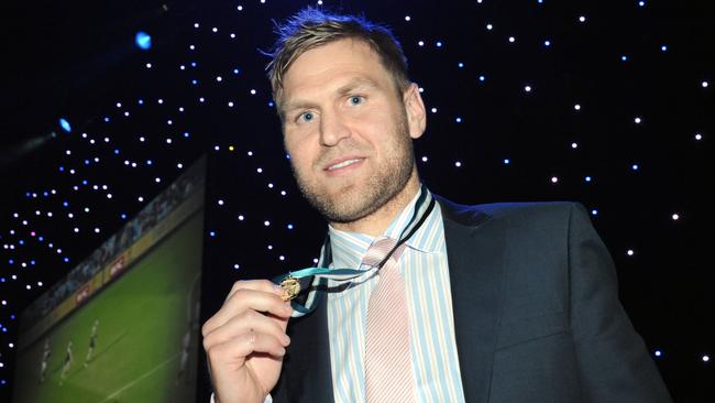 One of many ... Kane Cornes with his fourth John Cahill Medal, in 2012. Picture: Brooke Whatnall