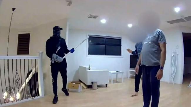 The intruders marched the housemates upstairs. Picture: 9News