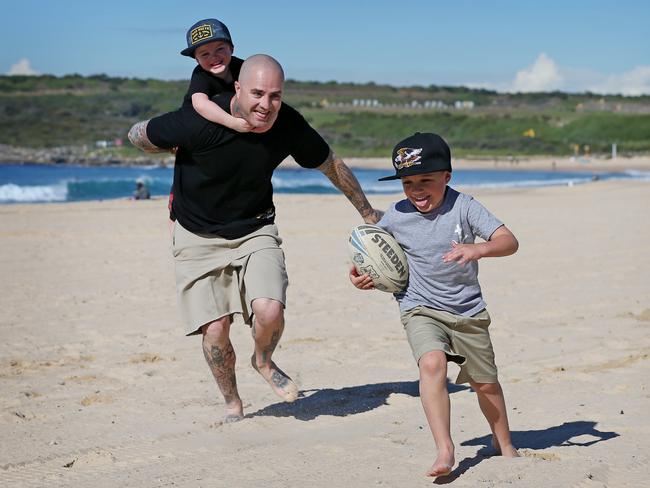 Ben Higgs, pictured playing with his sons Strummer, 5, and Sydney, 3, started the 24-hour treadmill challenge that is now being run at 280 Anytime Fitness gyms around Australia. Picture: Toby Zerna