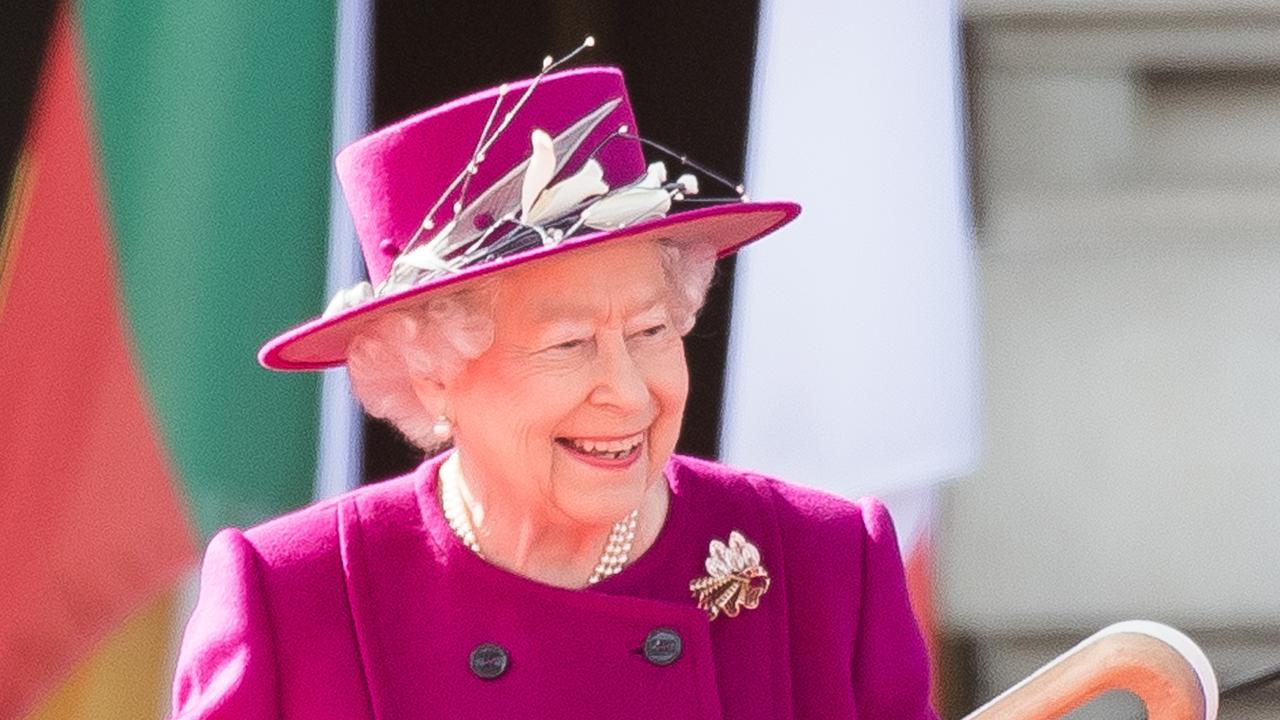 Queen Elizabeth II holds the Commonwealth baton during the launch of The Queen's Baton Relay for the XXI Commonwealth Games being held on the Gold Coast in 2018 at Buckingham Palace on March 13, 2017 in London, England. Picture: Samir Hussein/Samir Hussein/WireImage