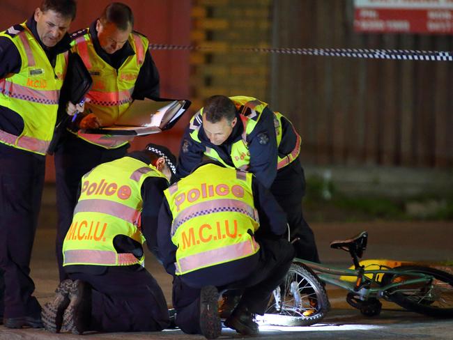 Police at the scene of a hit-run that left a teenage cyclist with critical injuries. Picture: Patrick Herve