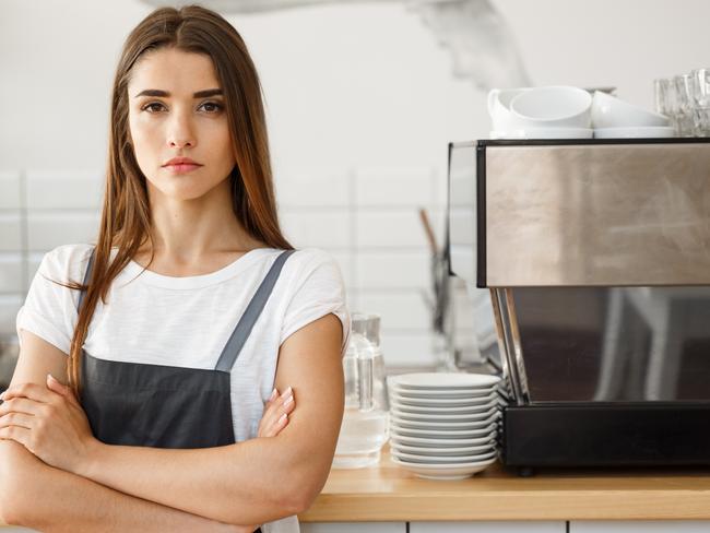 Coffee Business owner Concept - attractive young beautiful caucasian barista in apron with confident looking at camera in coffee shop counter.