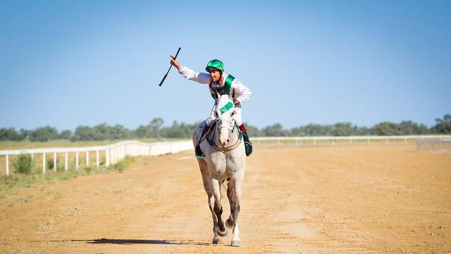 Jockey Justin Potter win the TAB Birdsville Cup Open Handicap 1600m on Neodium. Photo: Roxanne Weston