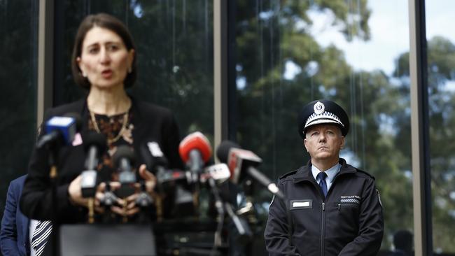 Mick Fuller stands behind Gladys Berejiklian at a press conference on coronavirus.