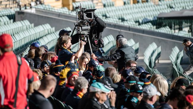 Never Too Late film crew sets up in front of Crows and Port Adelaide fans, sitting together on the southern side of Adelaide Oval. Picture: Morgan Sette