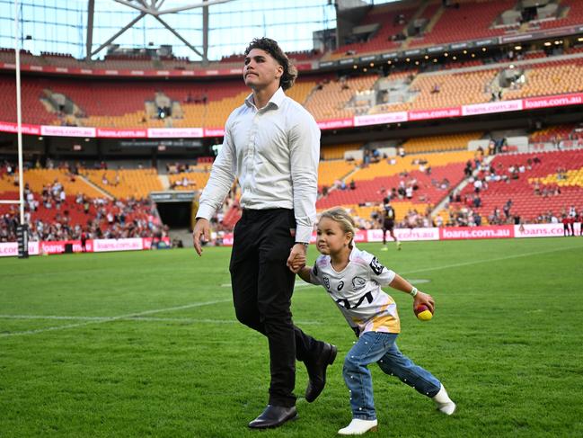 Reece Walsh with his daughter before Brisbane’s loss to St George Illawarra. Picture: NRL photos