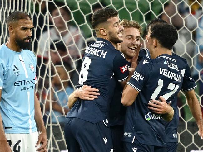 MELBOURNE, AUSTRALIA - OCTOBER 26: mv6is congratulated by team mates after scoring a goal during the round two A-League Men match between Melbourne City and Melbourne Victory at AAMI Park, on October 26, 2024, in Melbourne, Australia. (Photo by Quinn Rooney/Getty Images)