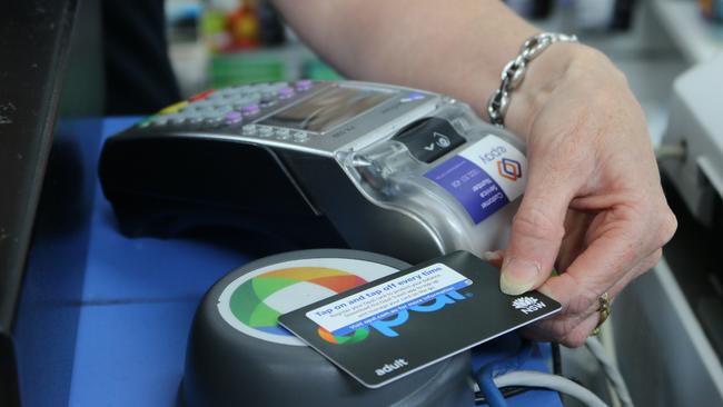 A newsagent in The Hills tops up a new opal card. Picture: Jake McCallum