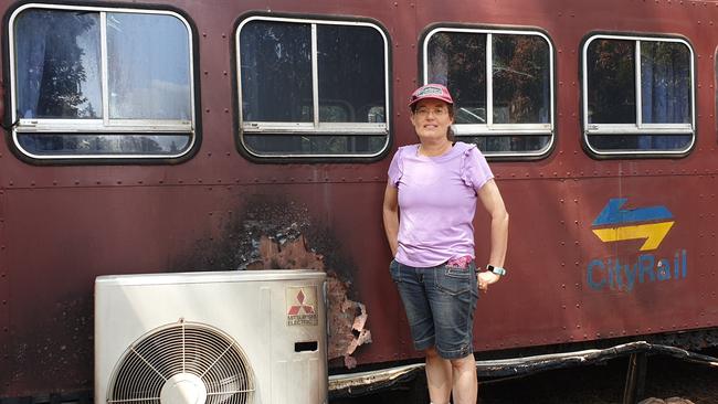 Debbie Redelman outside one of the damaged train carriages. Picture: Isabell Petrinic