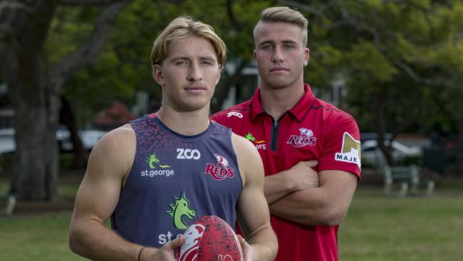 Young Reds pair Tate McDermott (left) and Hamish Stewart have always looked up to George Smith. Picture: Brendan Hertel, QRU