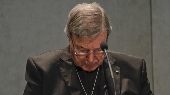 Cardinal George Pell talks with the media at the Vatican in June 2017.