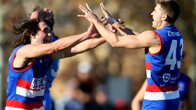 Central District’s Matthew Neagle (left) and Jackson Kelly celebrate a goal during the Bulldogs’ upset win against Sturt at Unley Oval on Saturday. Picture: Kelly Barnes