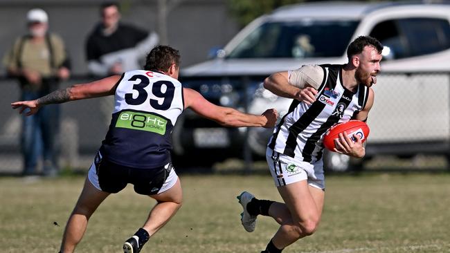 Melton CentralÃ&#149;s Ricky Hawkins and WallanÃ&#149;s Jarryd Bonello during the RDFL Melton Centrals v Wallan football match in Harkness, Saturday, April 23, 2022. Picture: Andy Brownbill