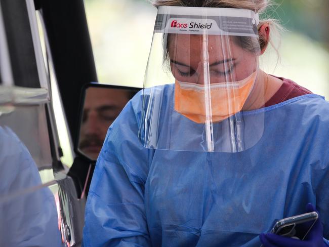 SYDNEY, AUSTRALIA - NewsWire Photos, SEPTEMBER, 20 2021: Nurses are seen conducting Covid-19 Tests at the Willoughby Drive Through testing Clinic in Sydney. Picture: NCA NewsWire / Gaye Gerard