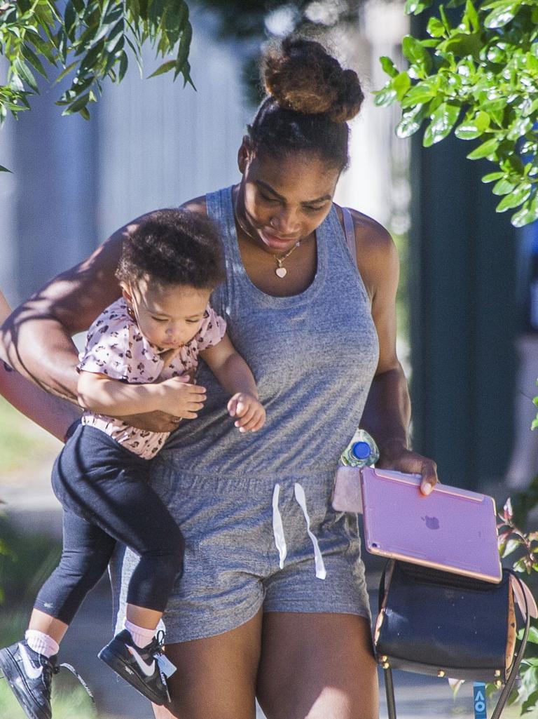 Serena Williams and her husband Alexis Ohanian enjoy an afternoon walk with their 1-year-old daughter Alexia Olympia. Serena's daughter looked seriously cute, toddling her way down the footpath, wearing Nike sneakers like her Mummy. Picture: MediaMode 