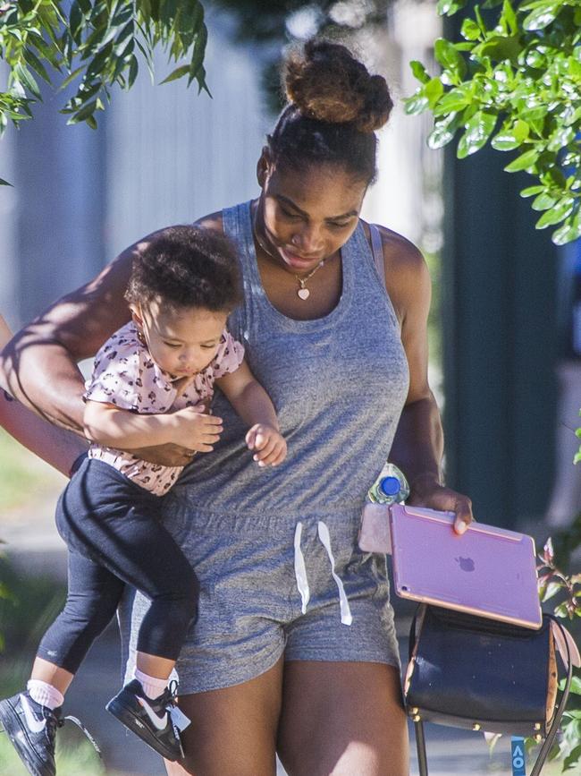 Serena Williams and her husband Alexis Ohanian enjoy an afternoon walk with their 1-year-old daughter Alexia Olympia. Serena's daughter looked seriously cute, toddling her way down the footpath, wearing Nike sneakers like her Mummy. Picture: MediaMode