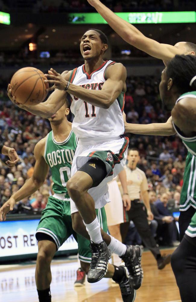 Bucks guard Brandon Knight goes up for a basket against the Celtics defence.