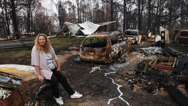 Venessa Downing next to some of the remains of her cars in Quaama Picture: Nikki Short.