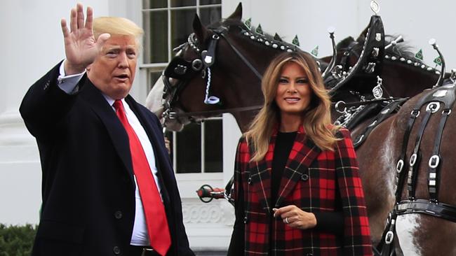 Mr and Mrs Trump take delivery of the White House Christmas tree. Picture: AP