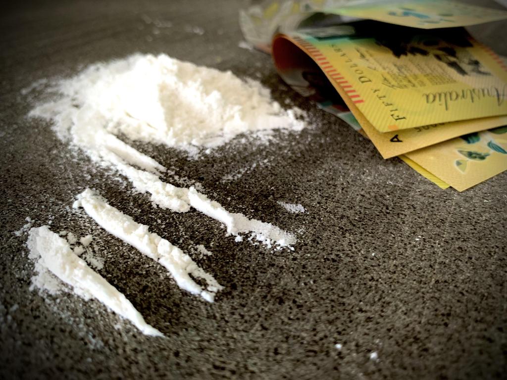 Police found cocaine and cash hidden in mail parcels.