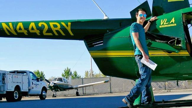 This 2018 photo provided by Bobby Berridge shows his son, Joseph Berridge, with a Robinson R44 helicopter. Picture: Suppied 