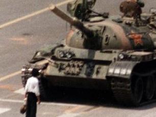 FILE - In this June 5, 1989 file photo, a Chinese protestor blocks a line of tanks heading east on Beijing's Cangan Blvd. June 5, 1989 in front of the Beijing Hotel. The man, calling for an end to the violence and bloodshed against pro-democracy demonstrators, was pulled away by bystanders, and the tanks continued on their way. Thursday June 4, 2009 marks the 20th anniversary of the Chinese military assault on demonstrators on the night of June 3-4, 1989 in Tiananmen Square. (AP Photo/Jeff Widener, File)