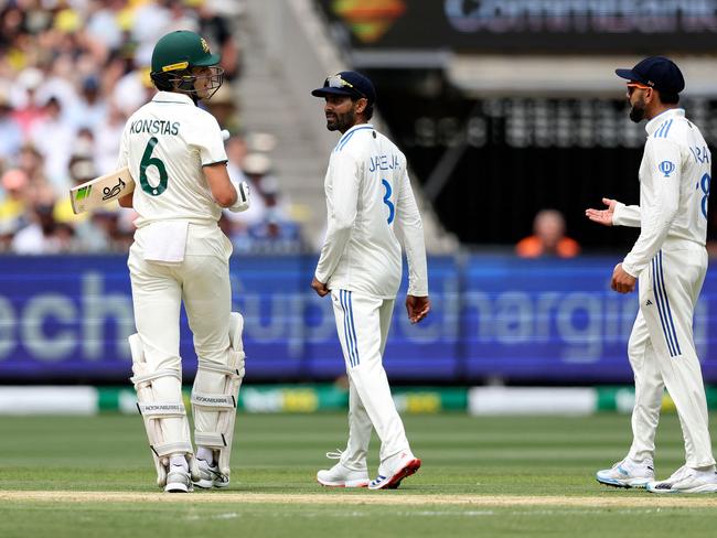 Konstas and Kohli exchange words after Kohli’s shoulder bump. Picture: Martin Keep / AFP