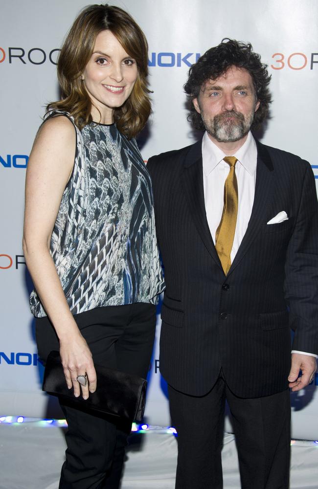 Tina Fey and her husband Jeff Richmond both are said to be 165cm, but the photos (and perhaps some very high heels) say otherwise. Picture: AP