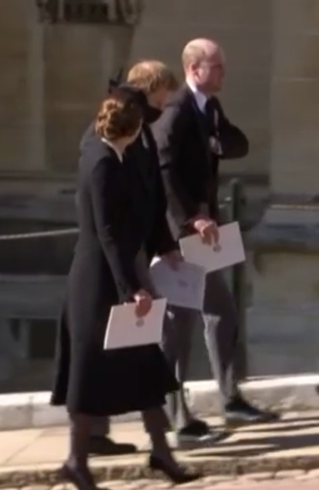 Kate Middleton, Prince Harry and Prince William walking together after the funeral service. Picture: 7NEWS