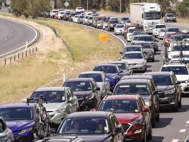 Cars backing up on the Hume Fwy after the announcement of a snap border closure. Picture: Simon Dallinger